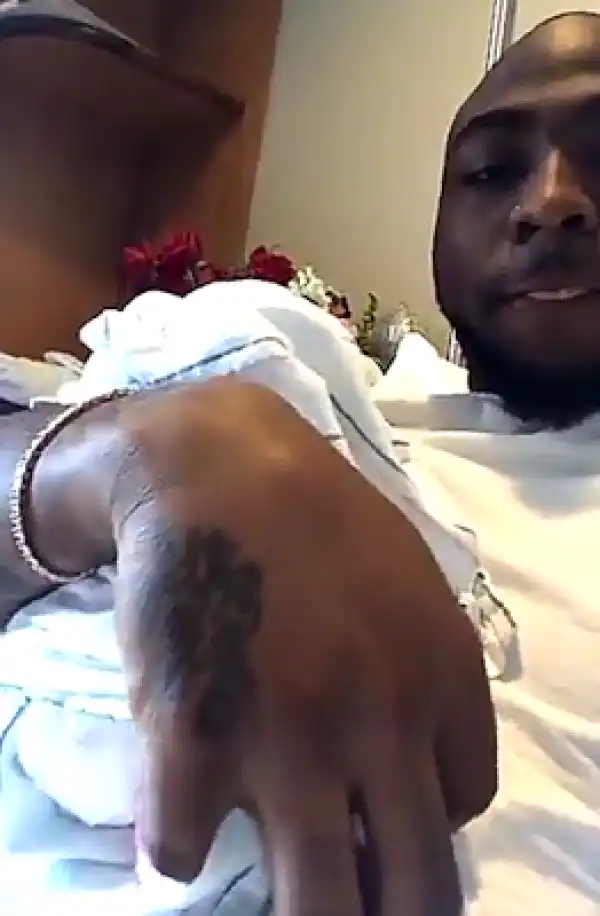 Singer Davido Cuddles His Newborn Daughter, Hailey, Makes Customized Jerseys For Them (Photo)